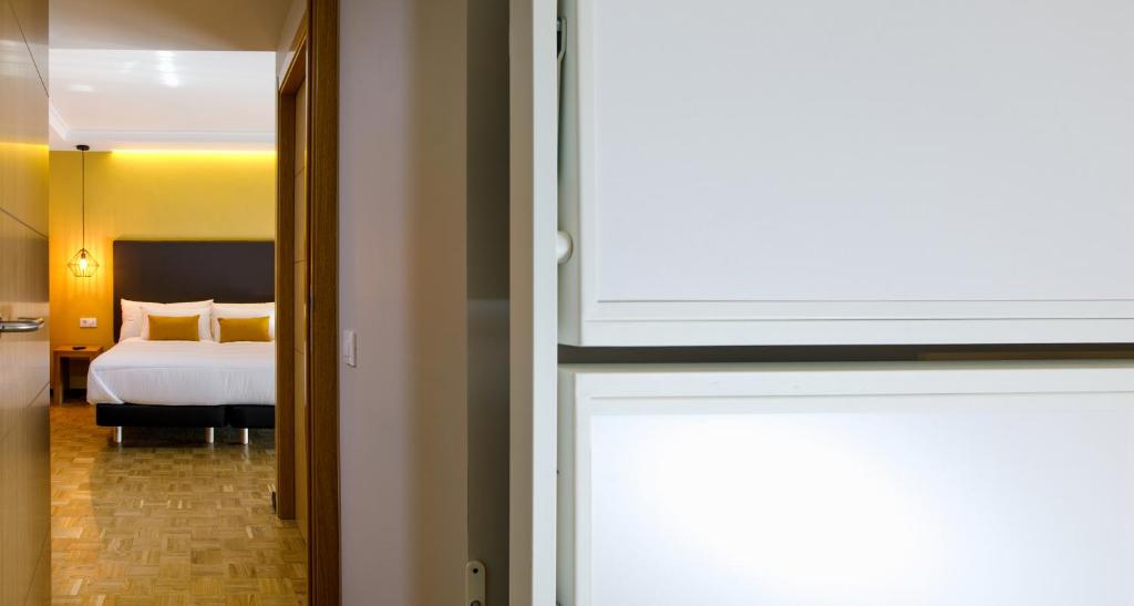 Posteľ alebo postele v izbe v ubytovaní Hotel Val Convention