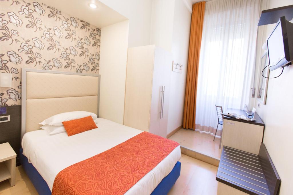 Postel nebo postele na pokoji v ubytování Hotel Piacenza