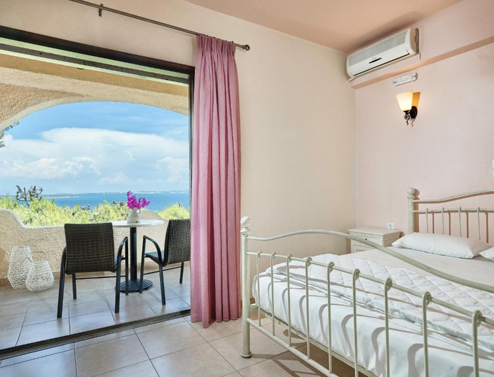 Postel nebo postele na pokoji v ubytování Hotel Abatis