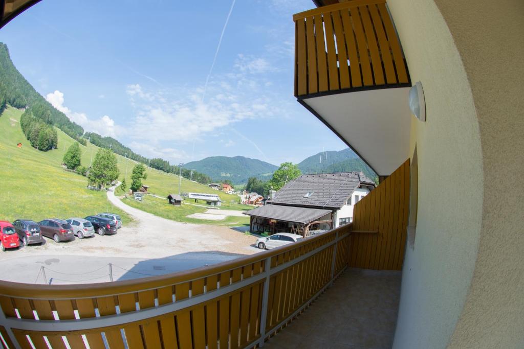 a balcony with a view of a parking lot at Apartment Katarina Kranjska Gora in Kranjska Gora