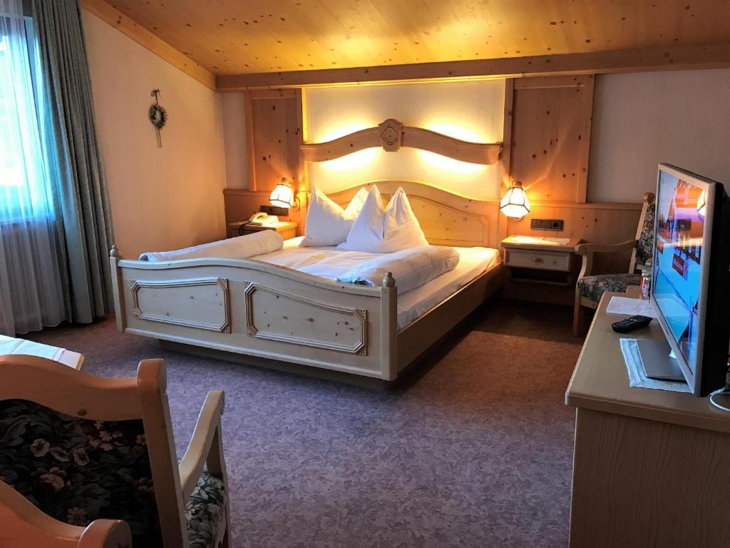 Voodi või voodid majutusasutuse Hotel Alpenrose toas