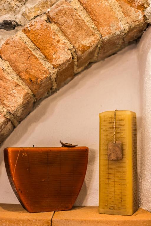 a yellow box sitting on a shelf next to a wall at Villa il Poderino in Marina di Campo