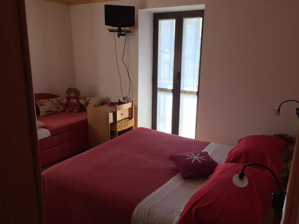 Voodi või voodid majutusasutuse Hotel Carrara toas