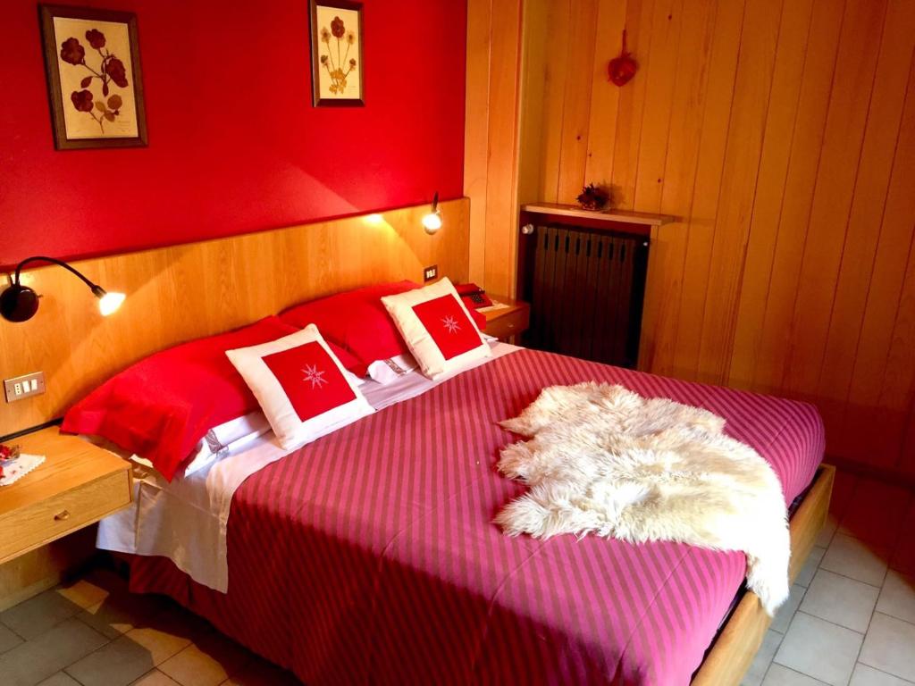 Voodi või voodid majutusasutuse Hotel Carrara toas