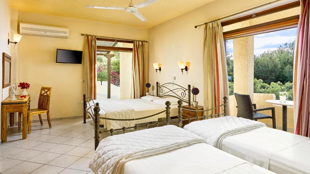 Postel nebo postele na pokoji v ubytování Hotel Abatis