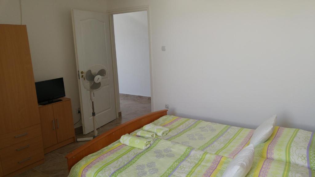 Posteľ alebo postele v izbe v ubytovaní Vasti Apartman