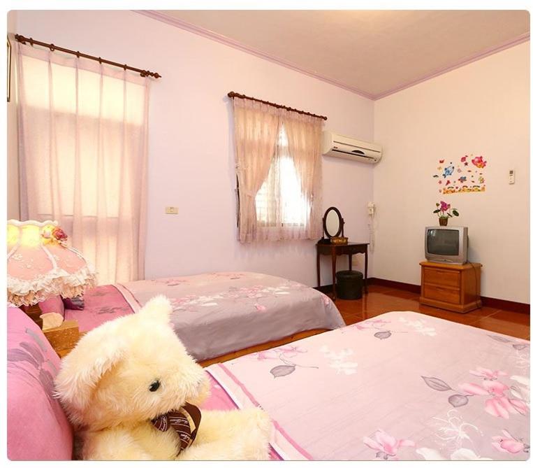 Postel nebo postele na pokoji v ubytování Yilan Xiang Feng Homestay