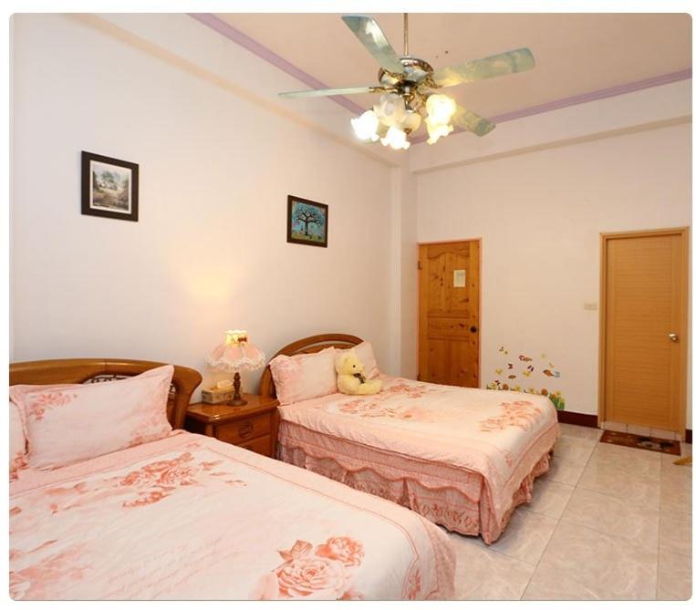 Postel nebo postele na pokoji v ubytování Yilan Xiang Feng Homestay