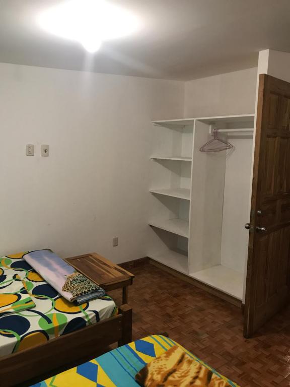 Postel nebo postele na pokoji v ubytování Hotel Cabanas La Teca