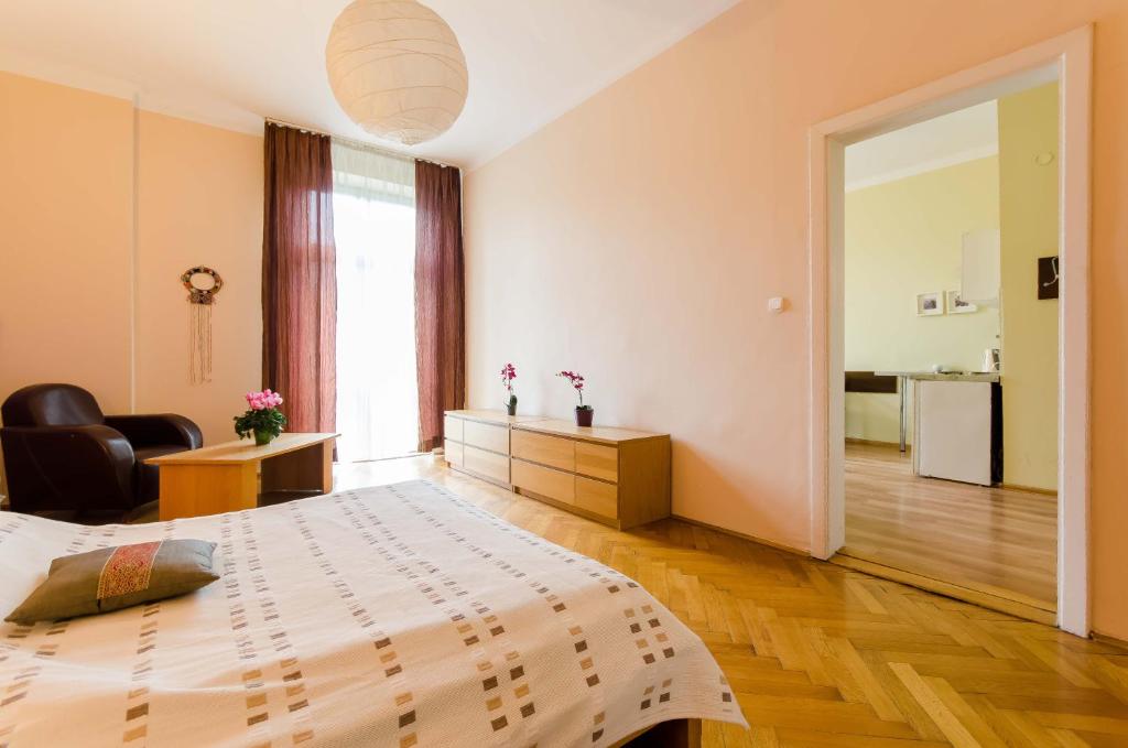 Postel nebo postele na pokoji v ubytování Fantasia Apartments