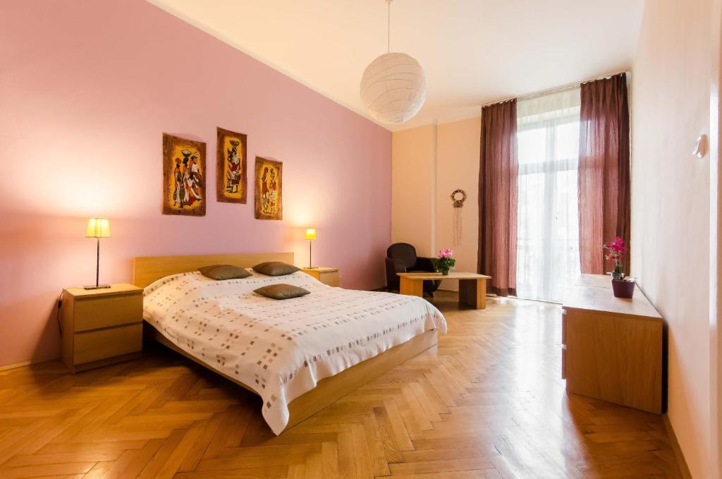 Postel nebo postele na pokoji v ubytování Fantasia Apartments