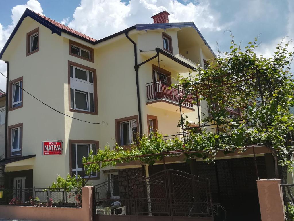 a large white building with a balcony at House Nativa in Ohrid