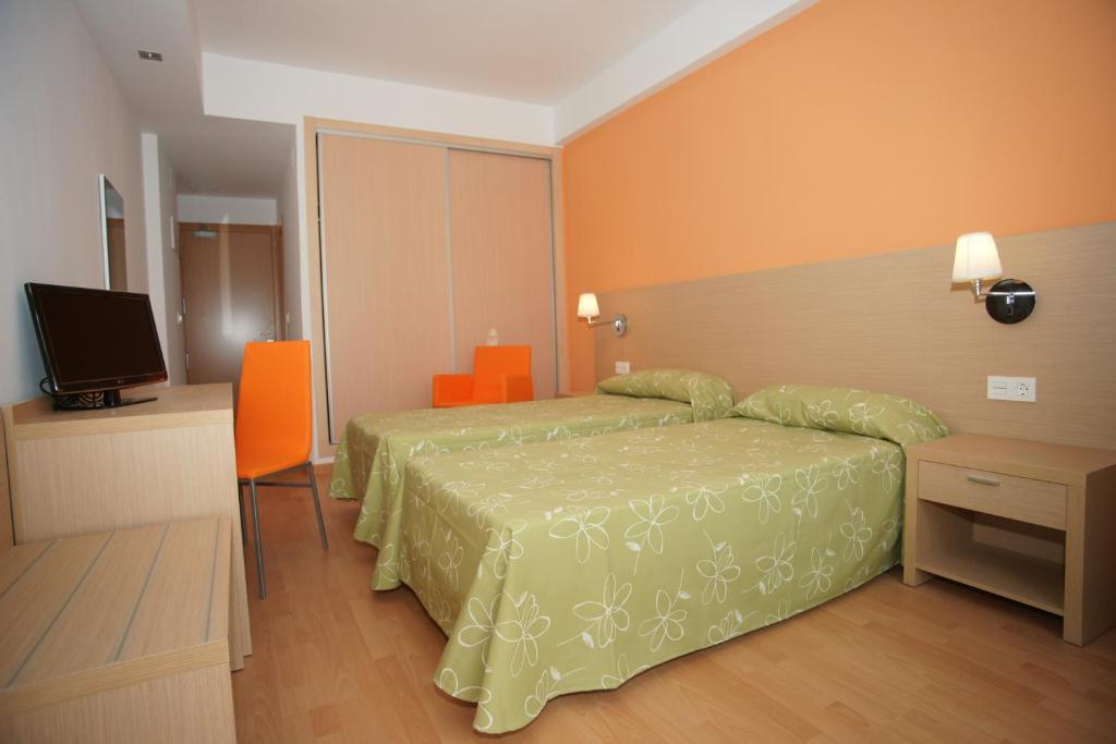 Postel nebo postele na pokoji v ubytování Hotel Golden