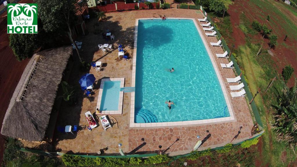 Bazén v ubytování Palmas Park Hotel y Restaurant nebo v jeho okolí