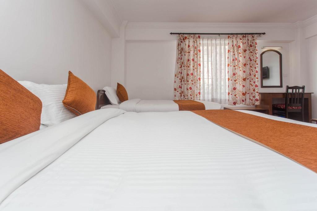 Postel nebo postele na pokoji v ubytování Fuji Hotel