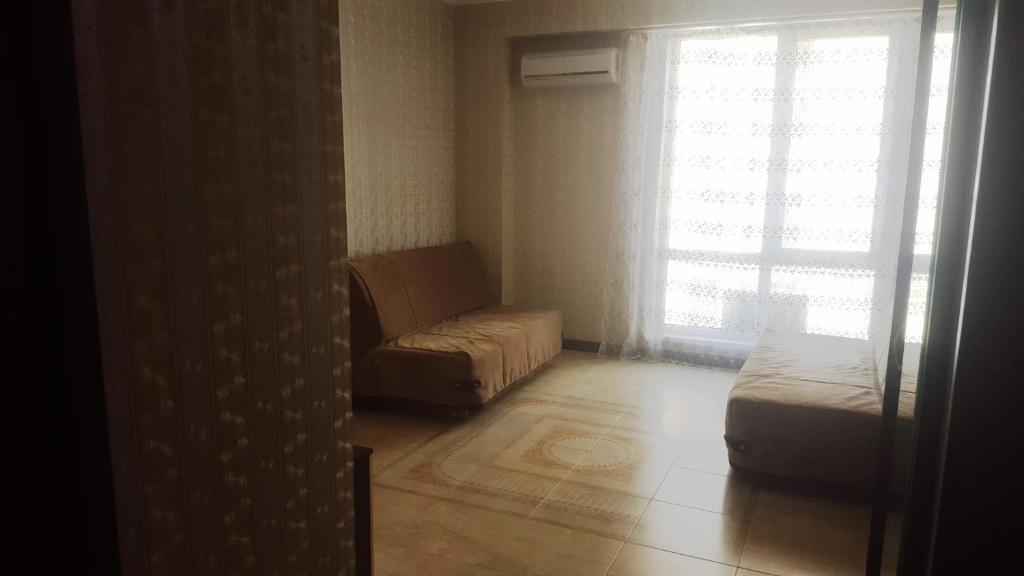 En eller flere senge i et værelse på Apartment on Volzhskaya 34