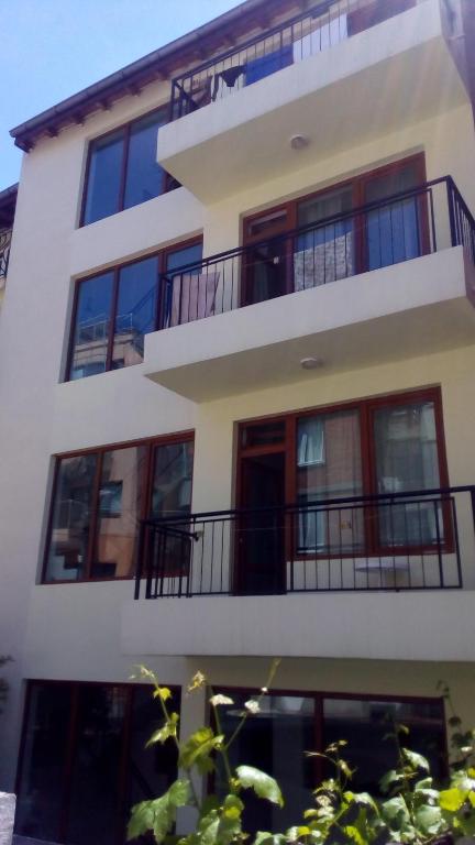 a building with balconies on the side of it at Guest House Diamant in Sozopol
