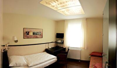 Postel nebo postele na pokoji v ubytování Hotel Am Braunen Hirsch