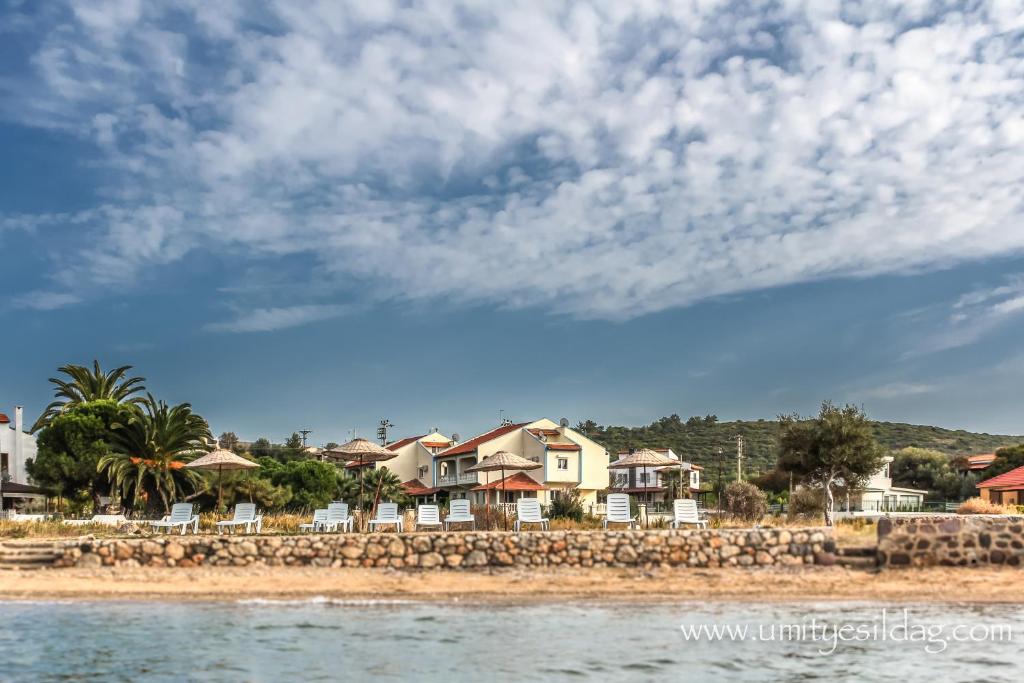 a group of houses on the shore of a beach at Seaside Villas Rental in Çeşme