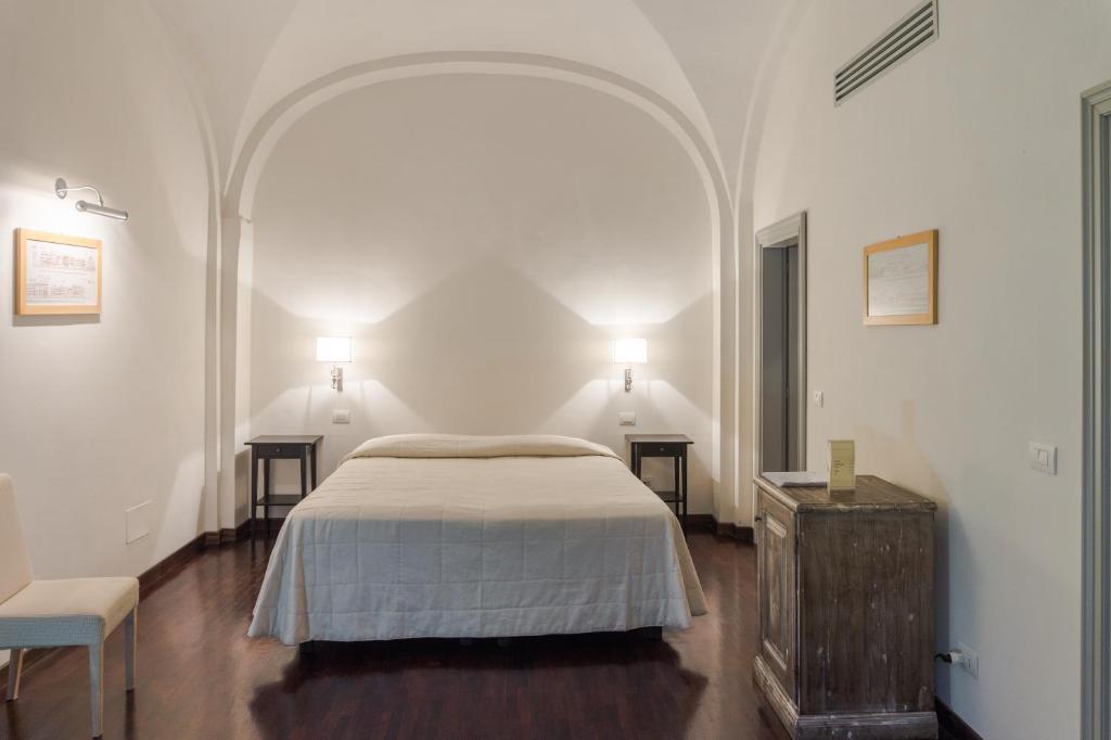 Posteľ alebo postele v izbe v ubytovaní Relais Villa Il Palagio