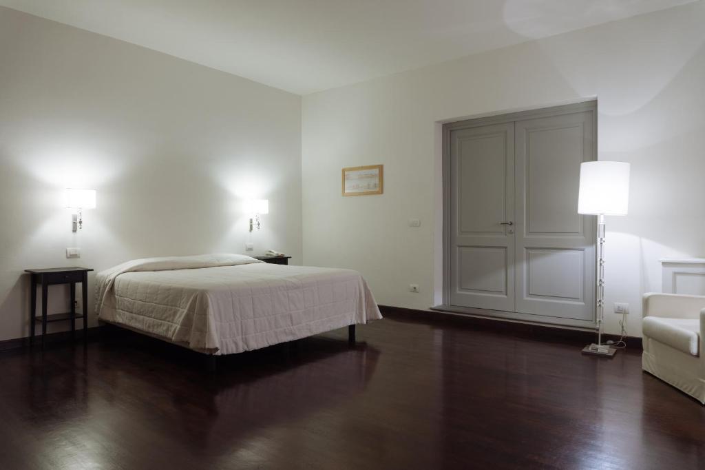 Posteľ alebo postele v izbe v ubytovaní Relais Villa Il Palagio