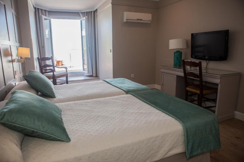 Posteľ alebo postele v izbe v ubytovaní Hotel Doña Blanca