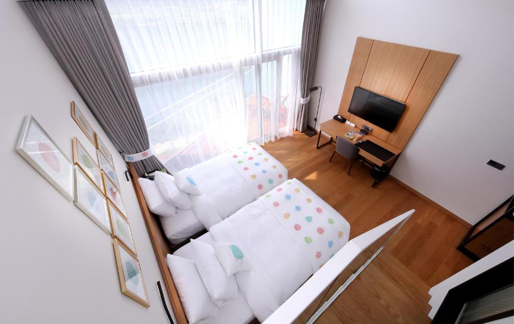 Postel nebo postele na pokoji v ubytování Midas Hotel & Resort