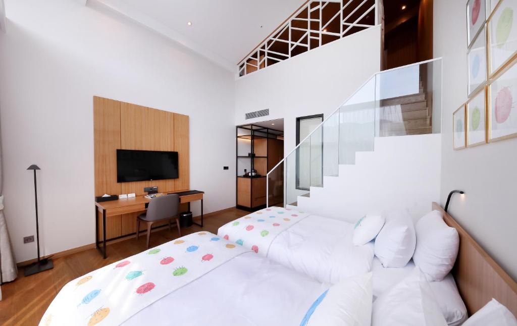 Postel nebo postele na pokoji v ubytování Midas Hotel & Resort