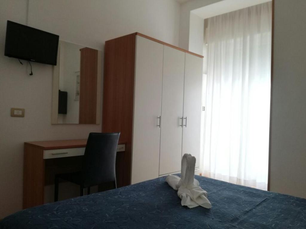 Postel nebo postele na pokoji v ubytování Hotel Atlas