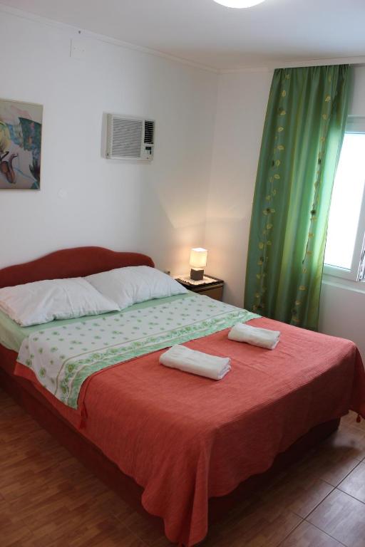Postel nebo postele na pokoji v ubytování Guest House Dada