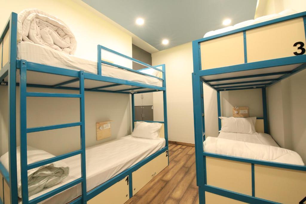 Postel nebo postele na pokoji v ubytování Blue Beds Hostel