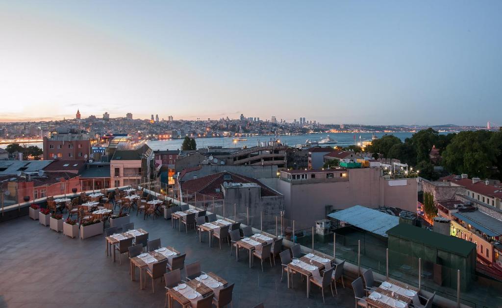 a view of a city with tables and buildings at DoubleTree by Hilton Istanbul - Sirkeci in Istanbul