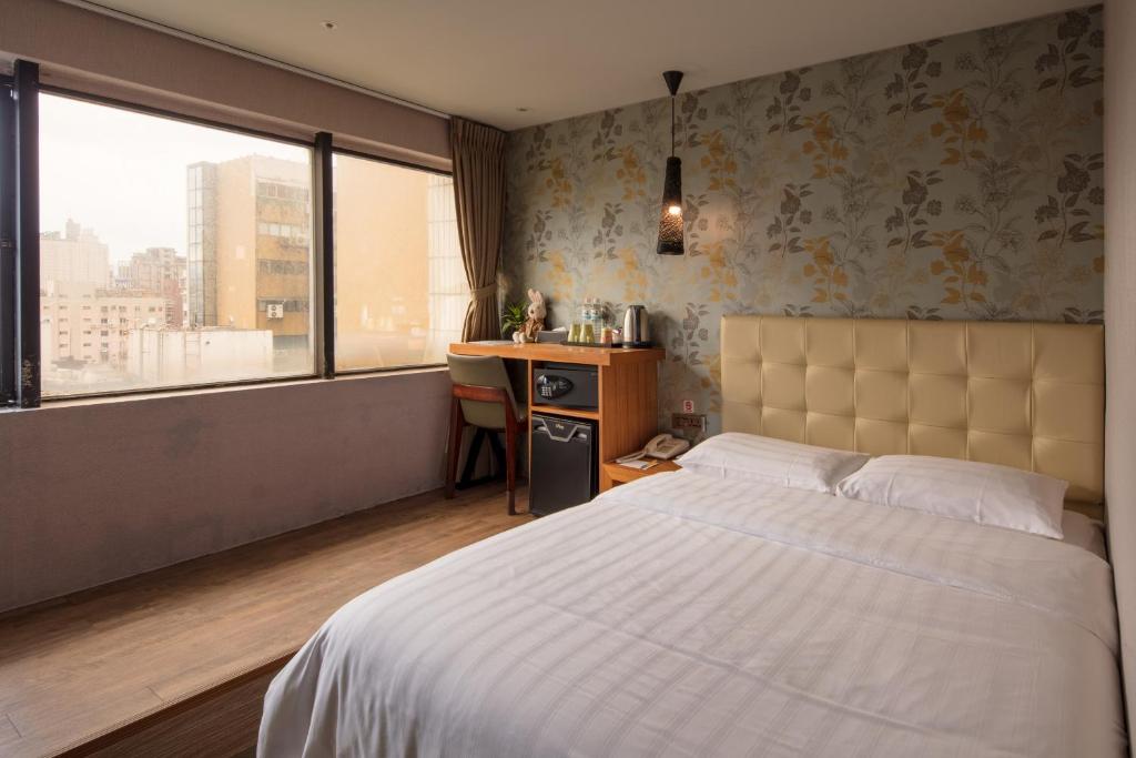 Postel nebo postele na pokoji v ubytování Urtrip Hotel