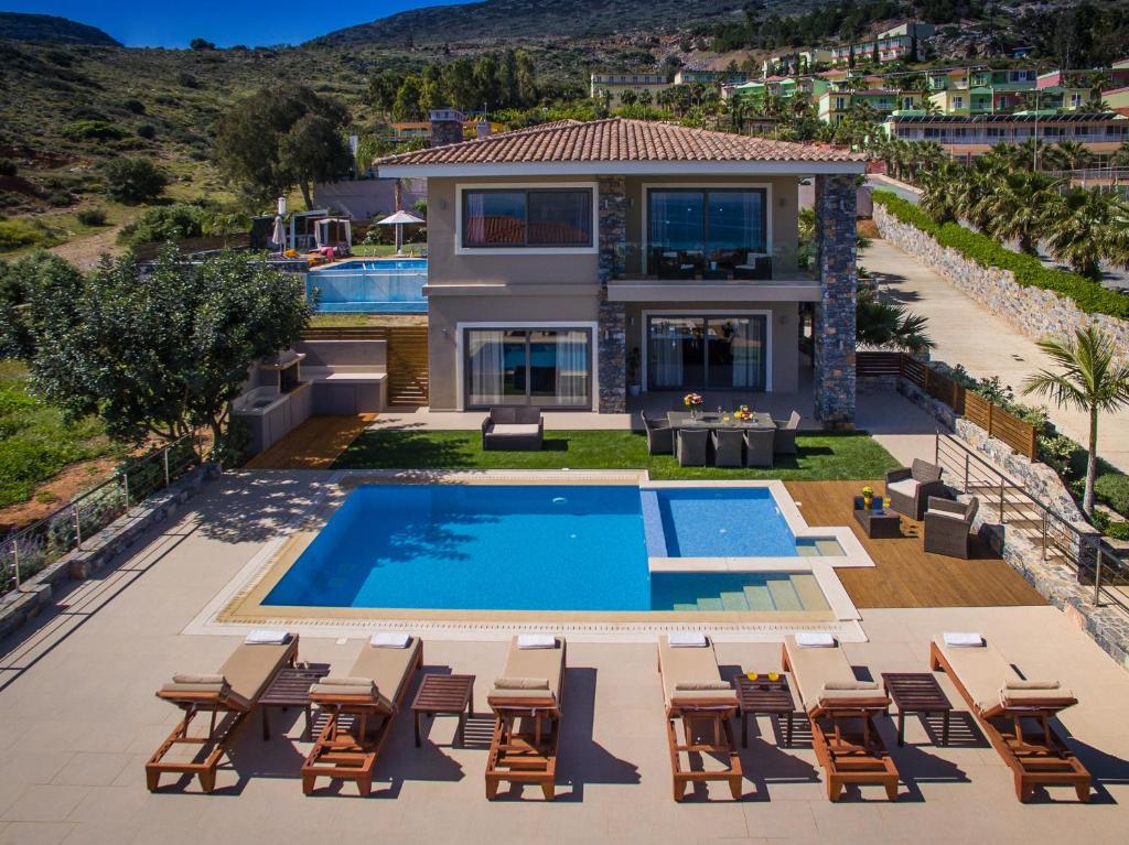 an aerial view of a house with a swimming pool at Villa Belamar in Hersonissos