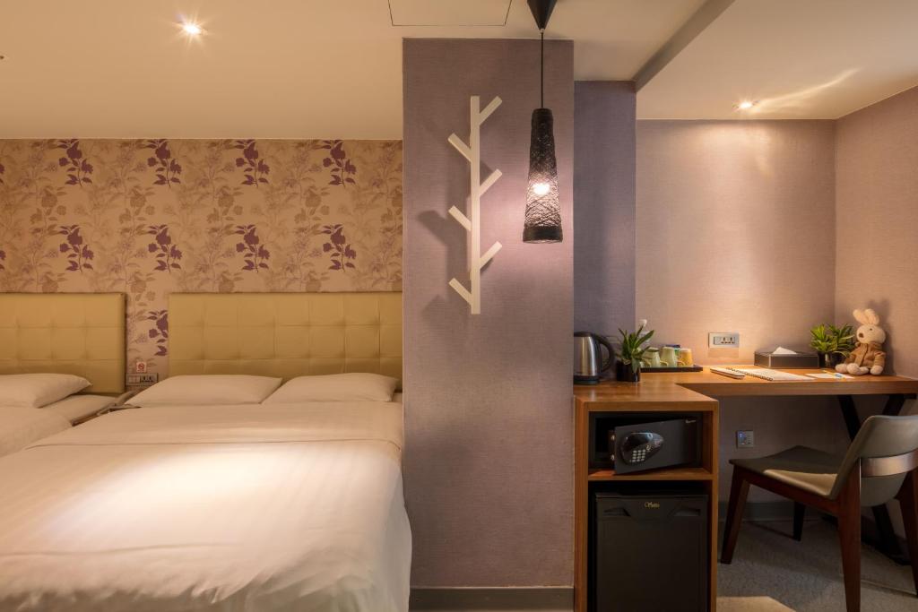 Postel nebo postele na pokoji v ubytování Urtrip Hotel