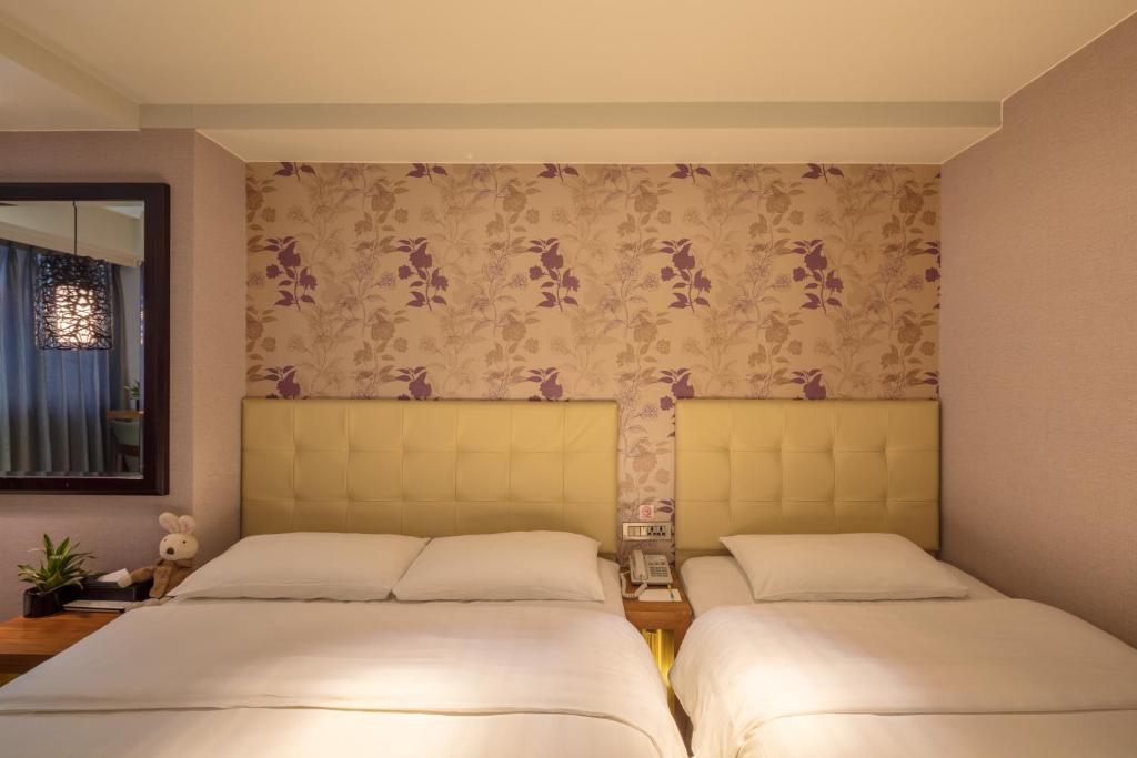 Postel nebo postele na pokoji v ubytování Urtrip Hotel