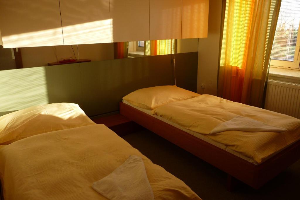 Postel nebo postele na pokoji v ubytování Hotel Solitaire