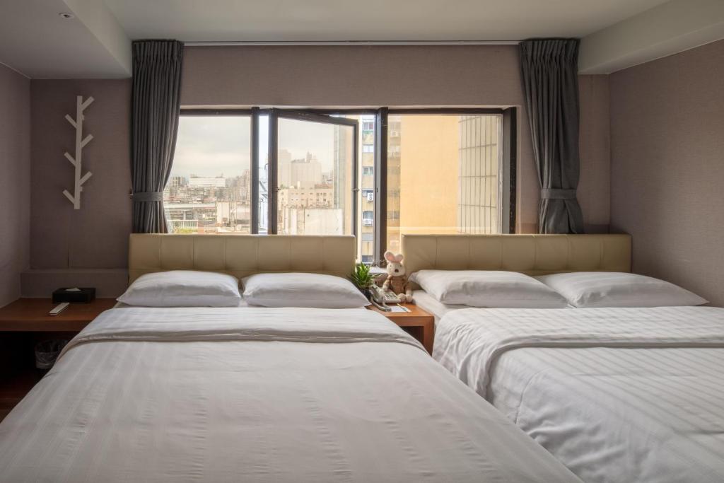 Postel nebo postele na pokoji v ubytování Urtrip Hotel