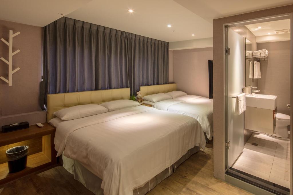 Postel nebo postele na pokoji v ubytování Urtrip Hotel