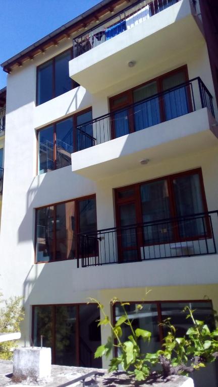 a building with balconies on the side of it at Guest House Diamant in Sozopol