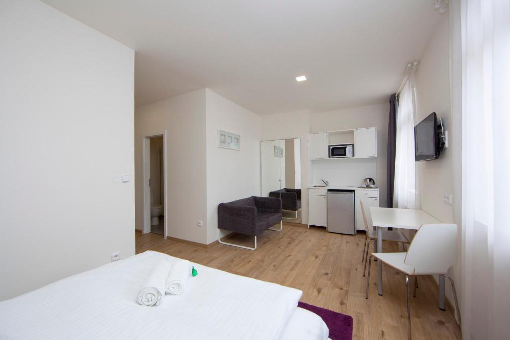 Kuchyň nebo kuchyňský kout v ubytování Rozmaryn Rooms & Apartments