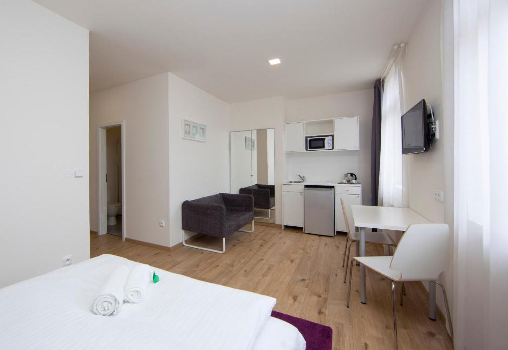 Kuchyň nebo kuchyňský kout v ubytování Rozmaryn Rooms & Apartments