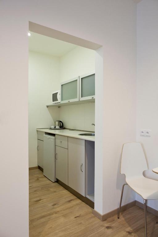 Kuchyň nebo kuchyňský kout v ubytování Rozmaryn Rooms & Apartments