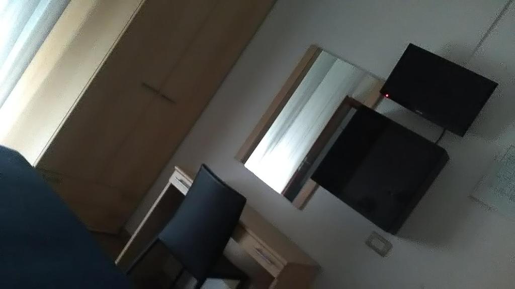TV a/nebo společenská místnost v ubytování Hotel Atlas