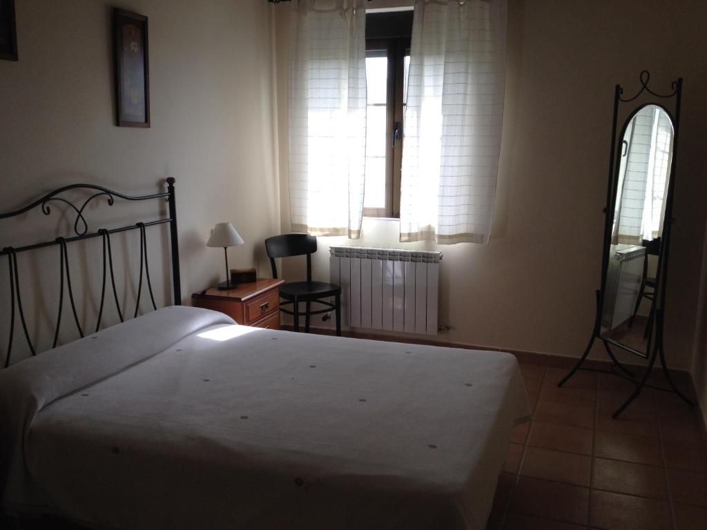 Postel nebo postele na pokoji v ubytování Casa Pico Zapatero