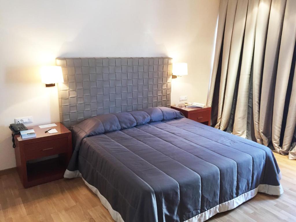 Postel nebo postele na pokoji v ubytování Theoxenia Residence