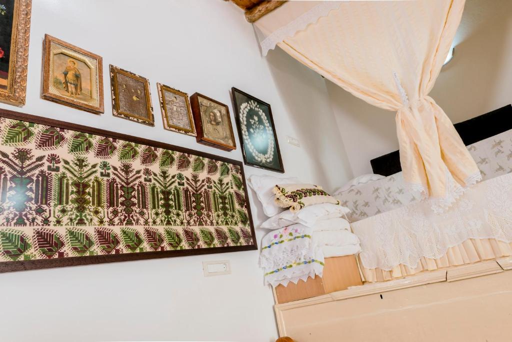 A bed or beds in a room at Kamariko Traditional House