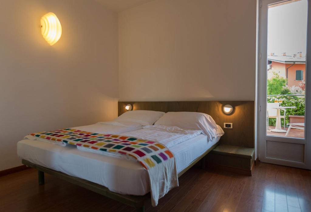 Postel nebo postele na pokoji v ubytování Hotel Al Caval