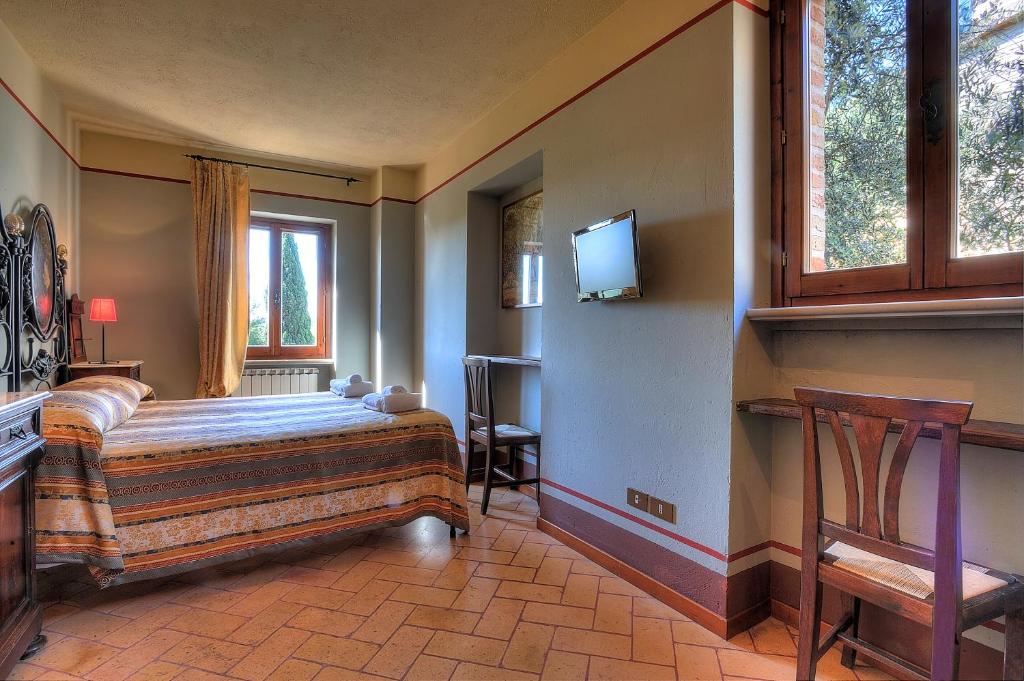 Postel nebo postele na pokoji v ubytování Albergo Diffuso Borgo Montemaggiore