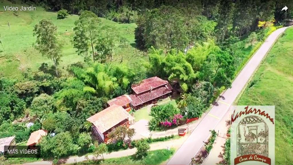an aerial view of a house in a field at Kantarrana Casa de Campo in Jardin